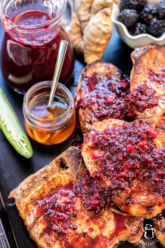 These grilled pork chops with blackberry sauce are a delightful whirlwind tour of your palate’s capabilities and a must-grill this season!