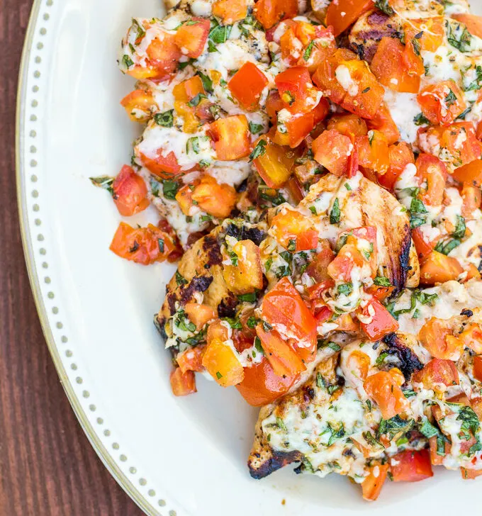 This incredibly simple recipe for grilled chicken bruschetta is one of our longest running family favorites during the spring and summer! It is fresh, full of flavor, light, and actually quite elegant!