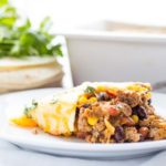 This delicious family favorite Mexican Lasagna recipe is made mostly from ingredients we always have in the pantry and it comes together in just 30 minutes!