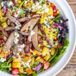 This is not your typical salad. It's got blue cheese. It's got potatoes. It's go steak. If you want a hearty, tasty dinner...cowboy steak salad!