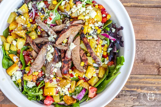This is not your typical salad. It's got blue cheese. It's got potatoes. It's go steak. If you want a hearty, tasty dinner...cowboy steak salad!