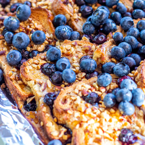 Made on the grill or the campfire, this Grilled Blueberry French Toast is smoky & decadent, but still fresh and sweet, thanks to the blueberries and syrup!