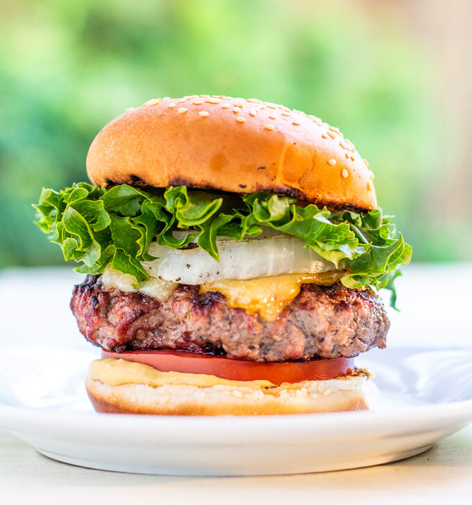 Bobby Flay put his spin on an otherwise traditional burger by adding grilled onions, horseradish mustard, and two cheeses - the double cheddar burger!