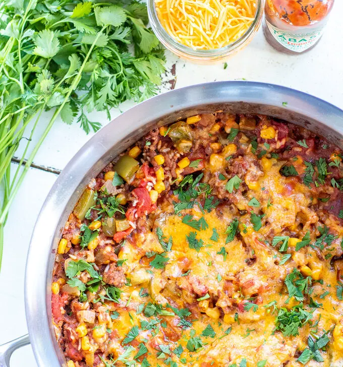 Busy family? This One Pan Spanish Rice Bake is for you. Other than the produce, it's a pantry meal, and it also comes together in a single pot!