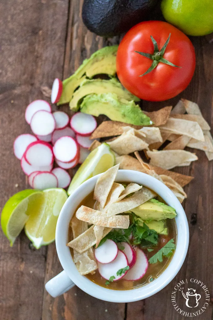 This comforting, brothy take on tex mex chicken tortilla soup is easy to make in a hurry, and features simple, staple ingredients and easy directions!