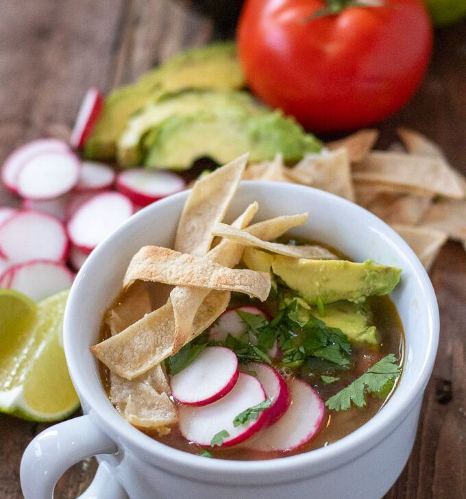 This comforting, brothy take on tex mex chicken tortilla soup is easy to make in a hurry, and features simple, staple ingredients and easy directions!