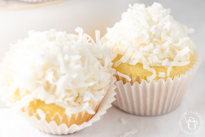 Light, fluffy, vanilla cake with cream cheese frosting makes up the base of this treat, but it's the shredded coconut that makes them snowball cupcakes!