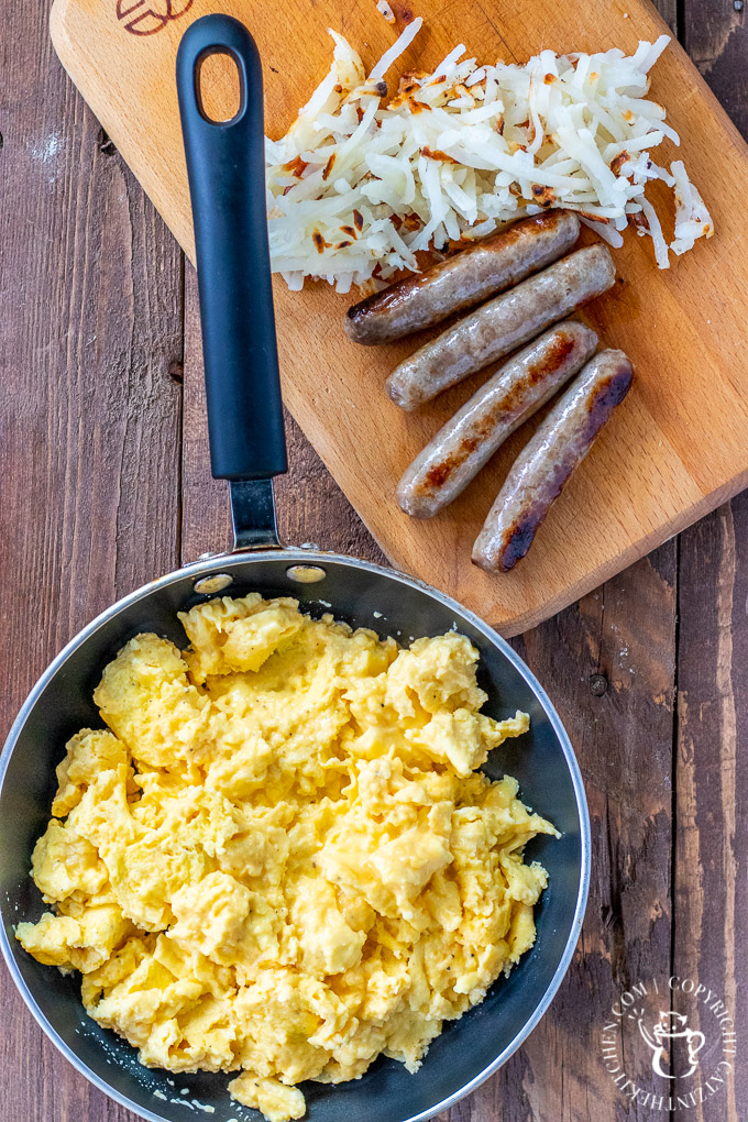 This incredibly simple four-ingredient recipe results in the best cheesy scrambled eggs we know how to make! Breakfast, brunch, or breakfast for dinner!