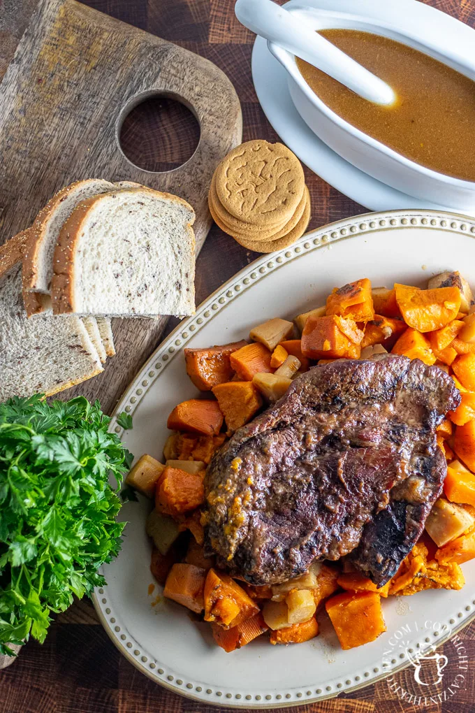Slow Cooker Gingersnap Pot Roast with rye bread and vegetables 