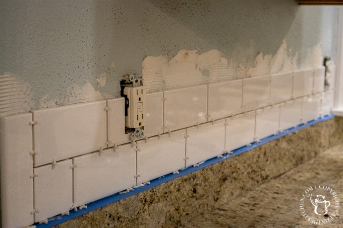 installing tile for DIY Subway Tile Backsplash