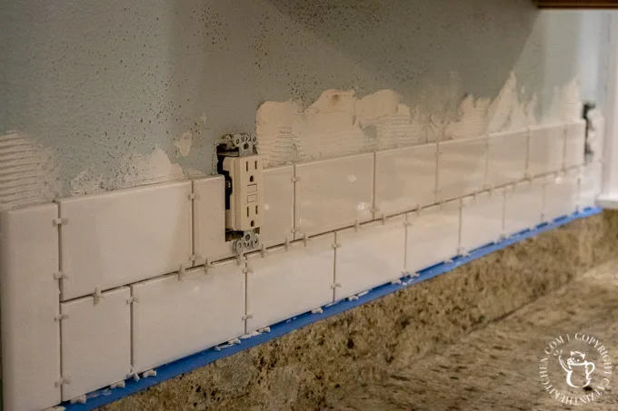 installing tile for DIY Subway Tile Backsplash