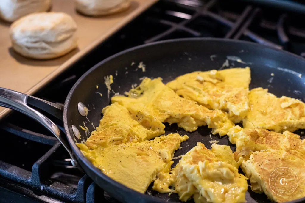 Egg preparation for Sausage Egg & Cheese Biscuit Breakfast Sandwiches