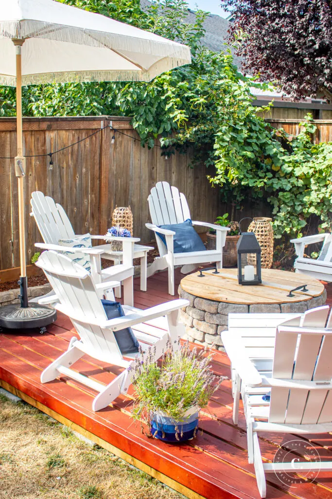 DIY floating deck with Adirondack chairs and umbrella 