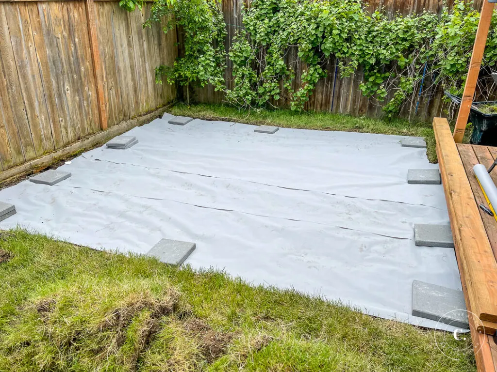laying weed barrier for floating deck 