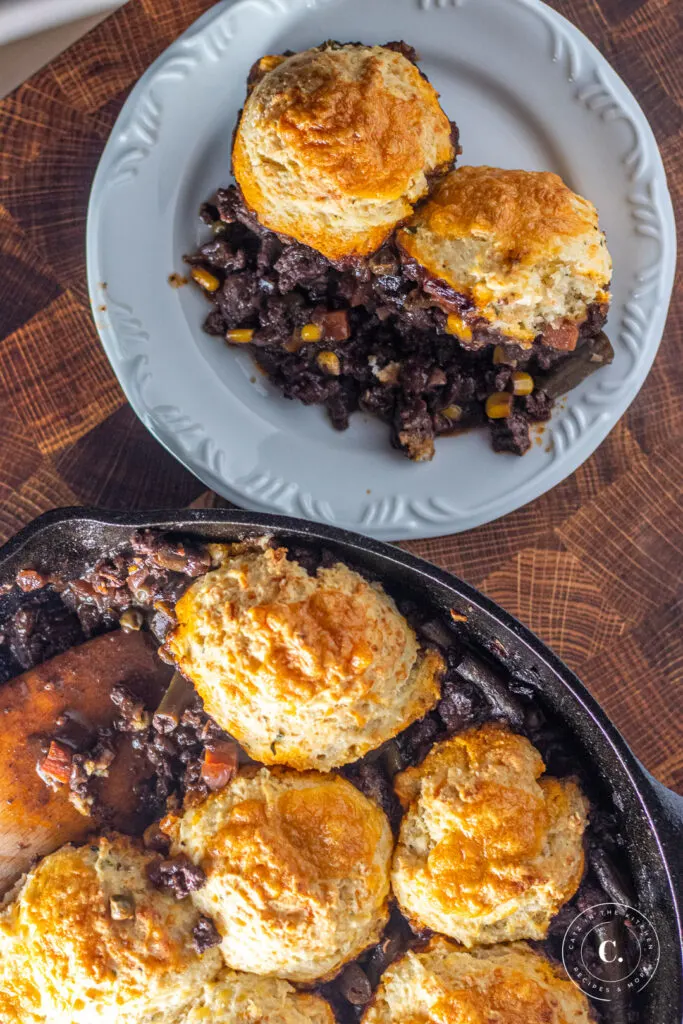 beef stew with biscuits on a plate 