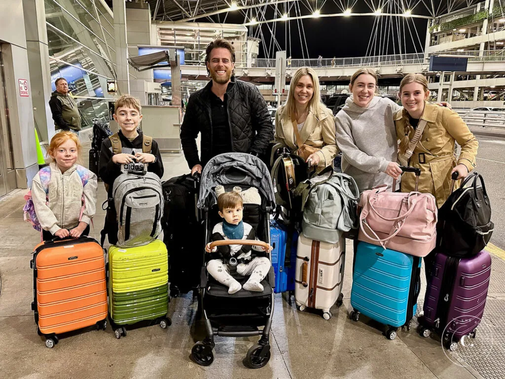 Our family with luggage at PDX airport 