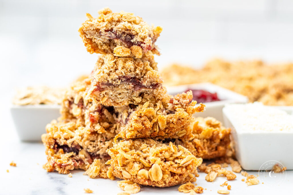 Coconut Raspberry Oat Bars in a stack 